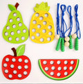Wooden fruit threading board placed in Montessori early education threading game